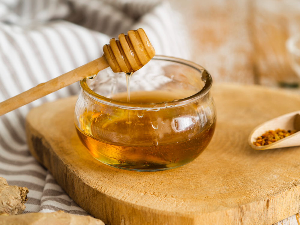 A wooden board with honey represents their significance in natural honey skincare solutions. 