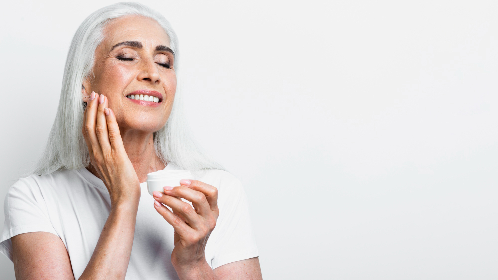 Smiley woman with age prevention product.