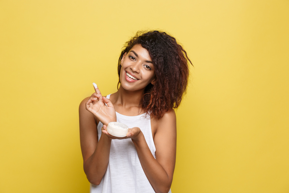 Asian women applying Glycolic Acid Cream