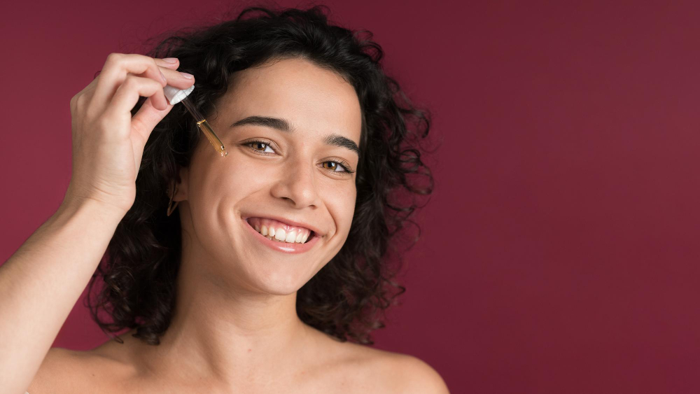 Beautiful women using Niacinamide serum.