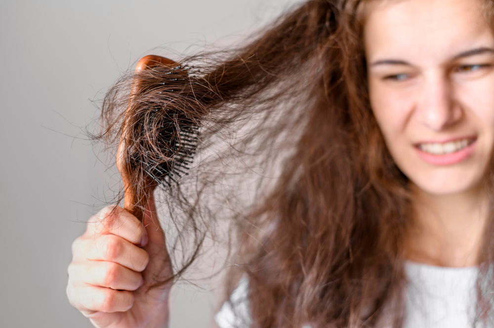 Woman experiencing hair loss.